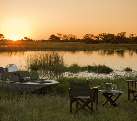 Boat And Drinks At Sunset on safari in Africa ®bushtreksafaris
